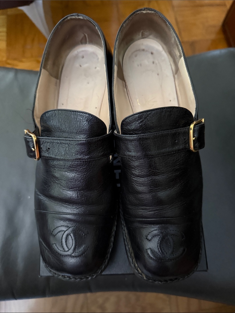 CHANEL Black Leather Slip-On Loafers with Gold Buckles